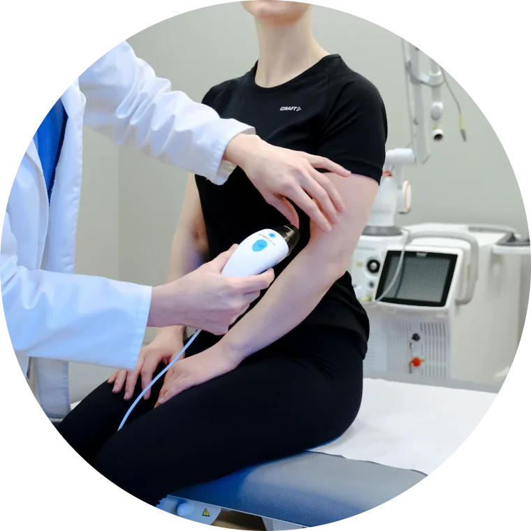 A clinician scanning a patient's arm with the DeepX device